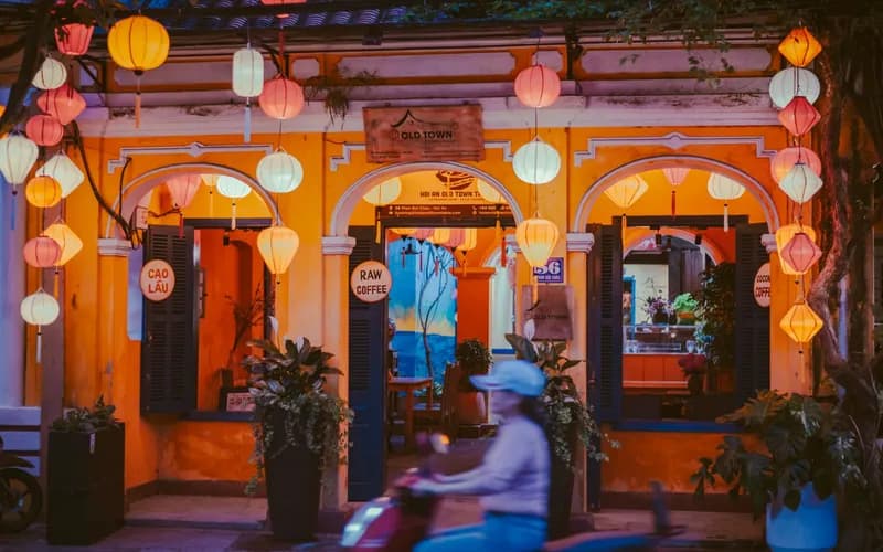 Traditional shophouses and lanterns along a quiet street in Luang Prabang's old town