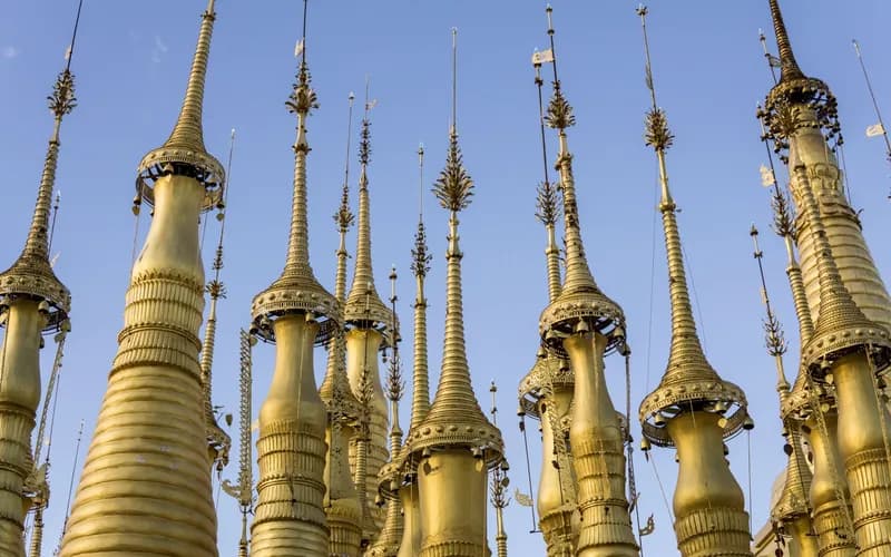 hillside stupas above river